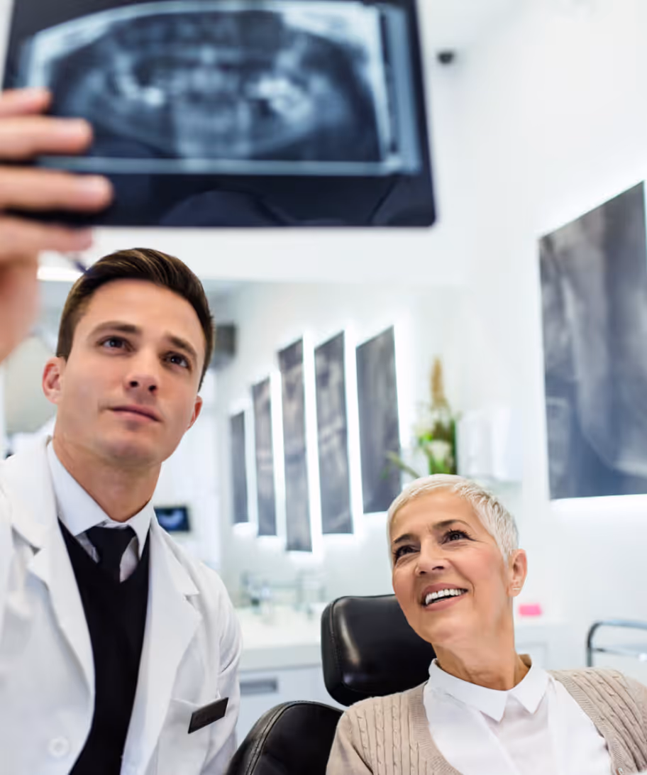 Oral surgeon with patient
