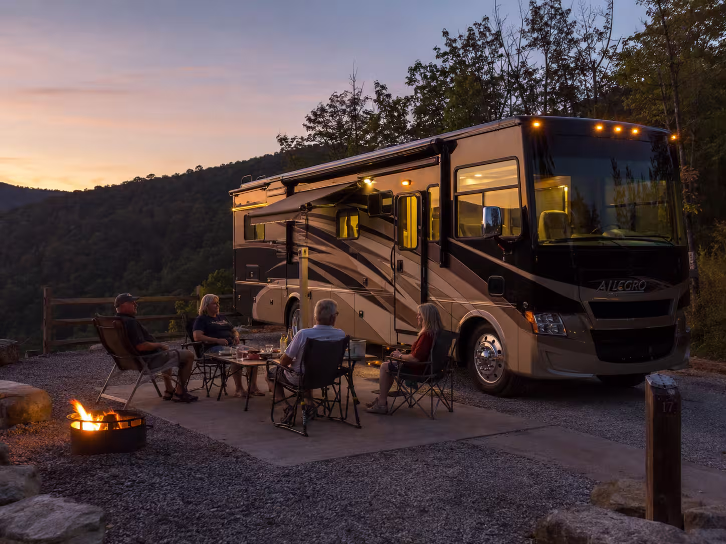 Group relaxing beside a Class A motorhome near Asheville