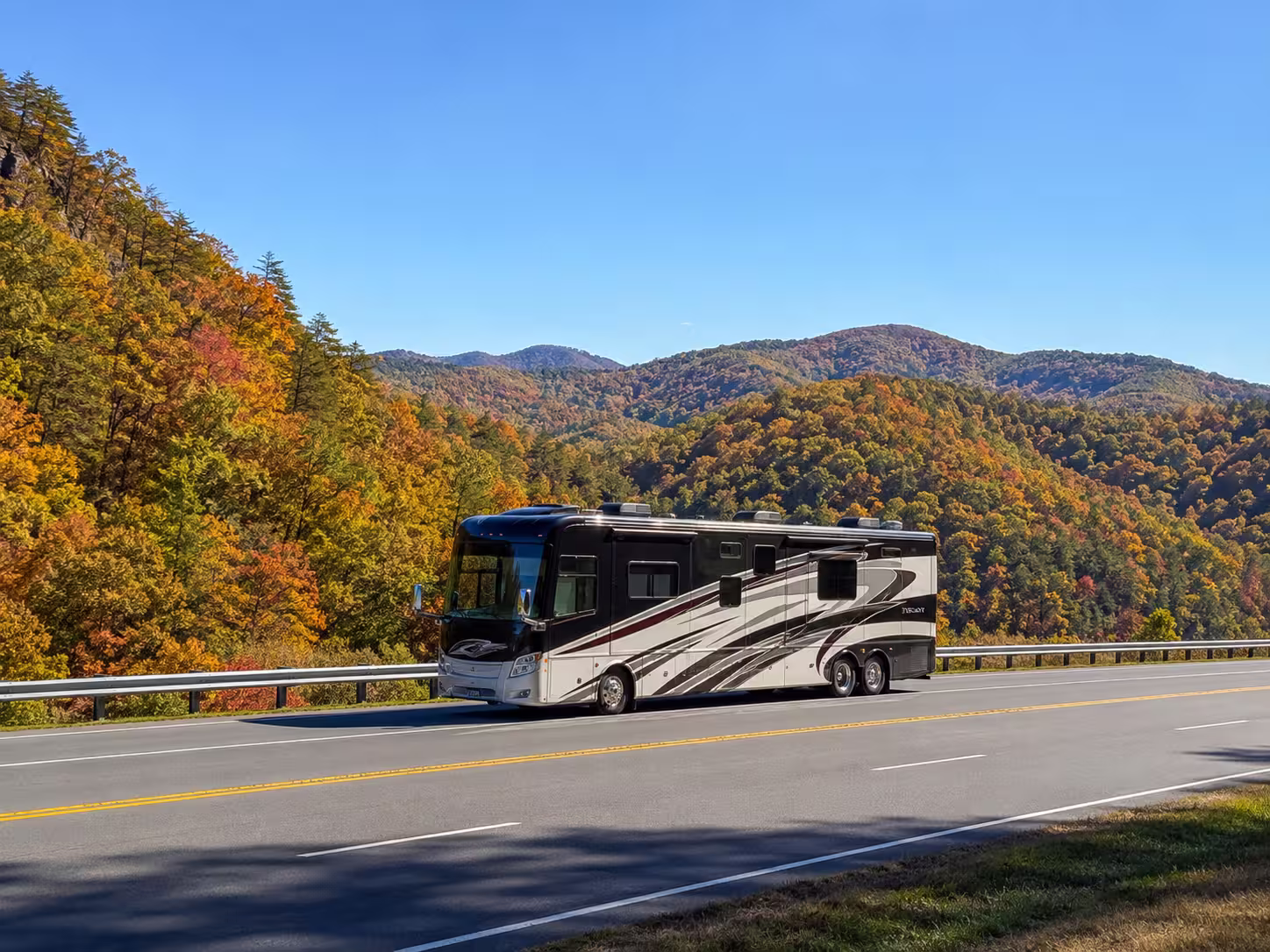 Class A motorhome on a fall mountain highway near Asheville