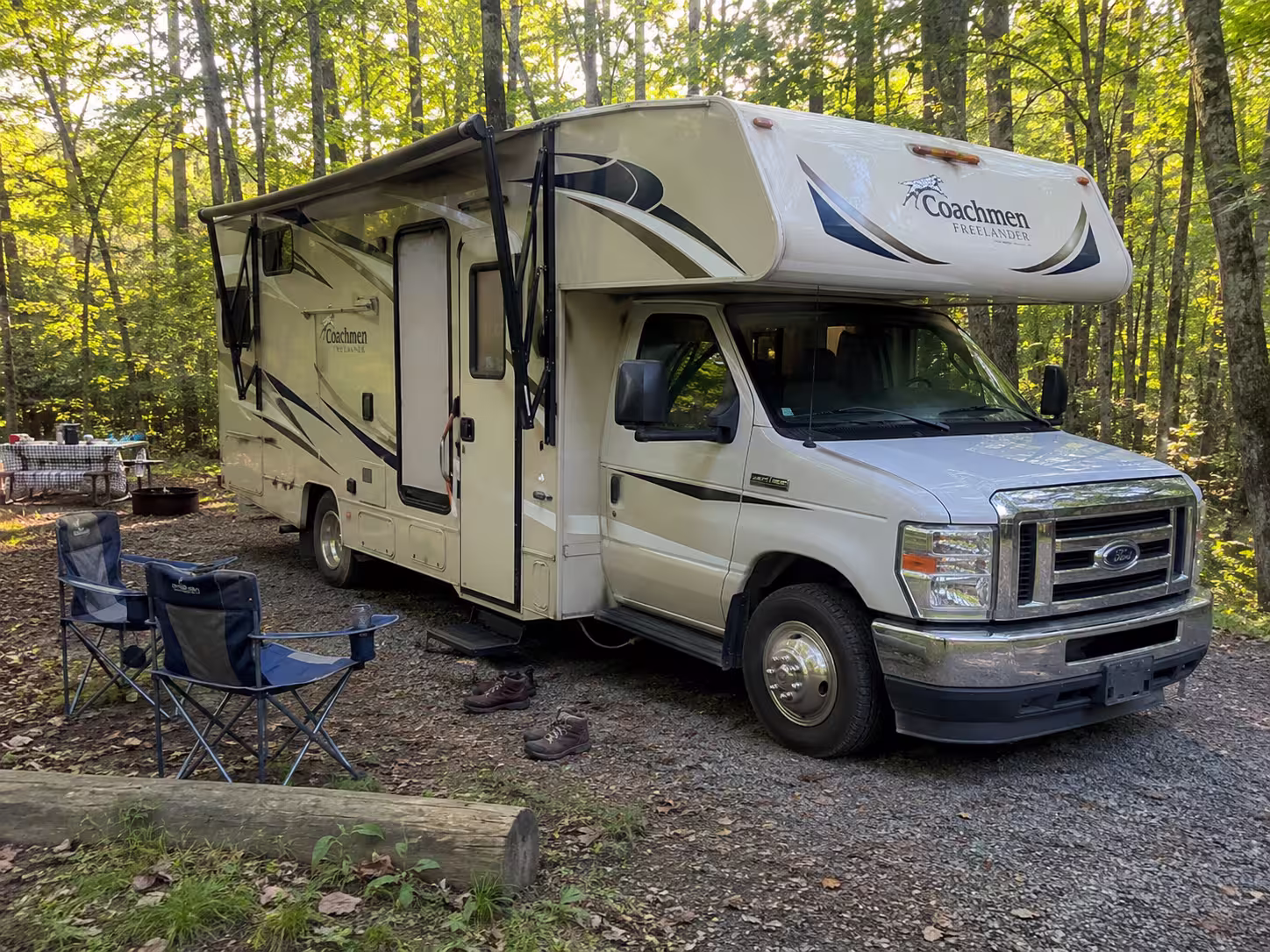 Class C motorhome at a wooded campsite near Pisgah, Asheville area