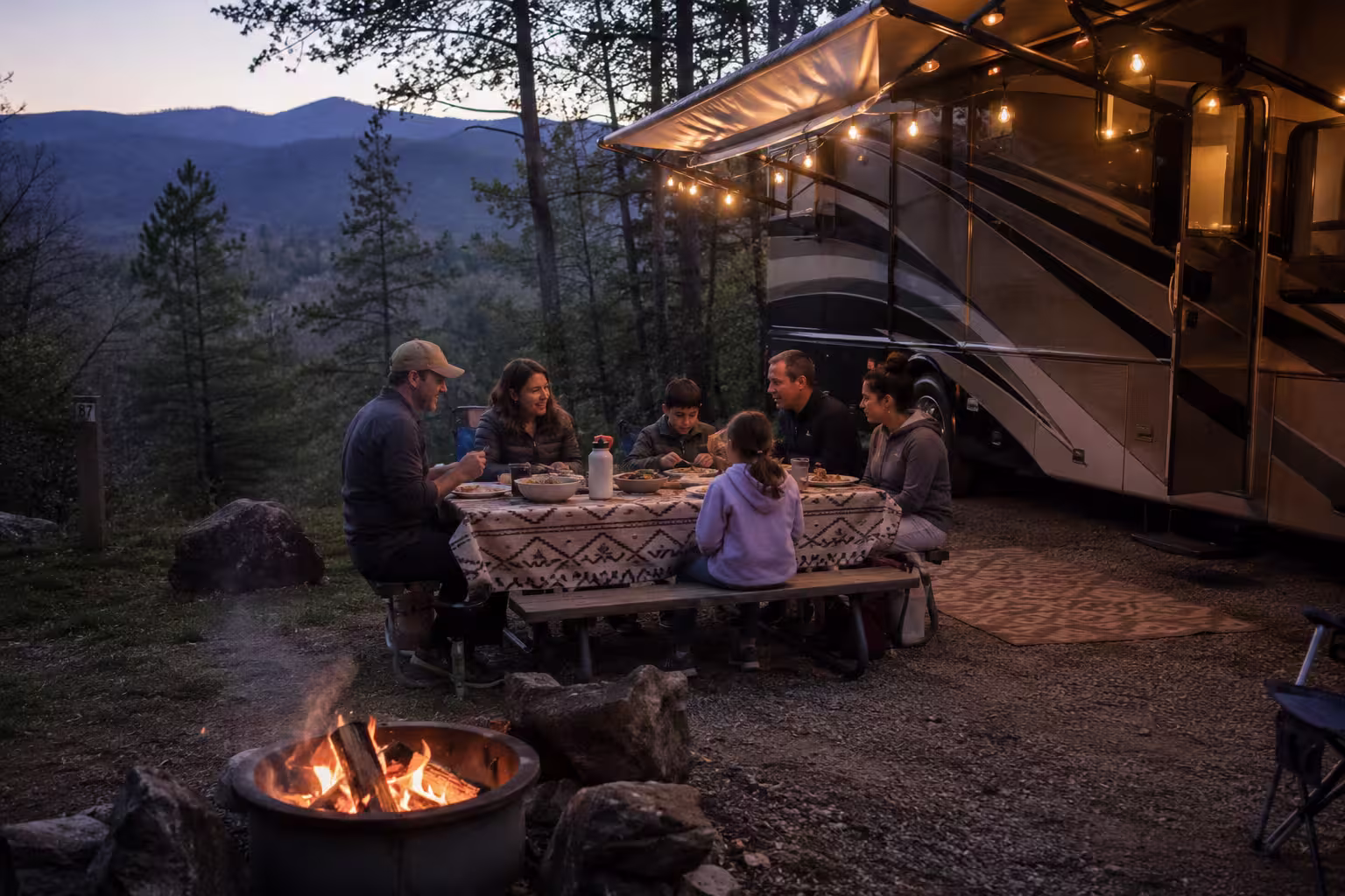 Group camping beside a large rental RV near Asheville, NC