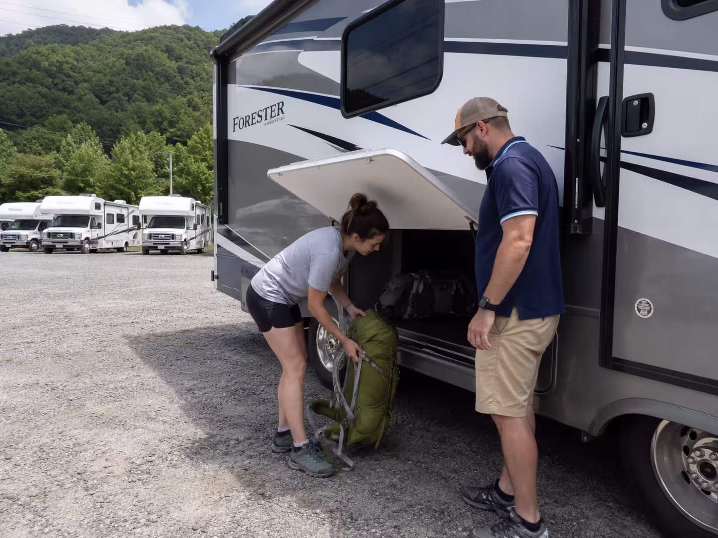 Renter loading gear into a motorhome at an Asheville, NC pickup lot