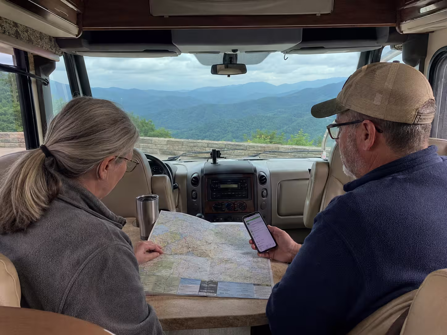 Couple planning a route inside a motorhome near Asheville, NC