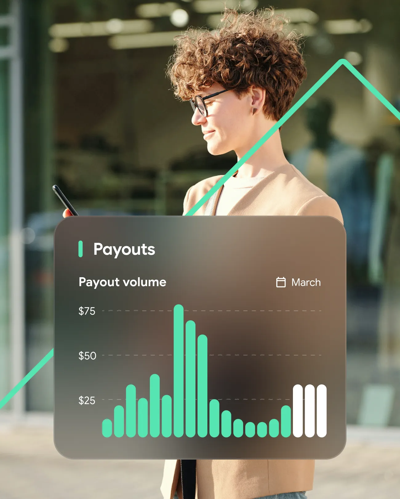 Person viewing a payout volume bar chart for March on a mobile device with peaks near $75.