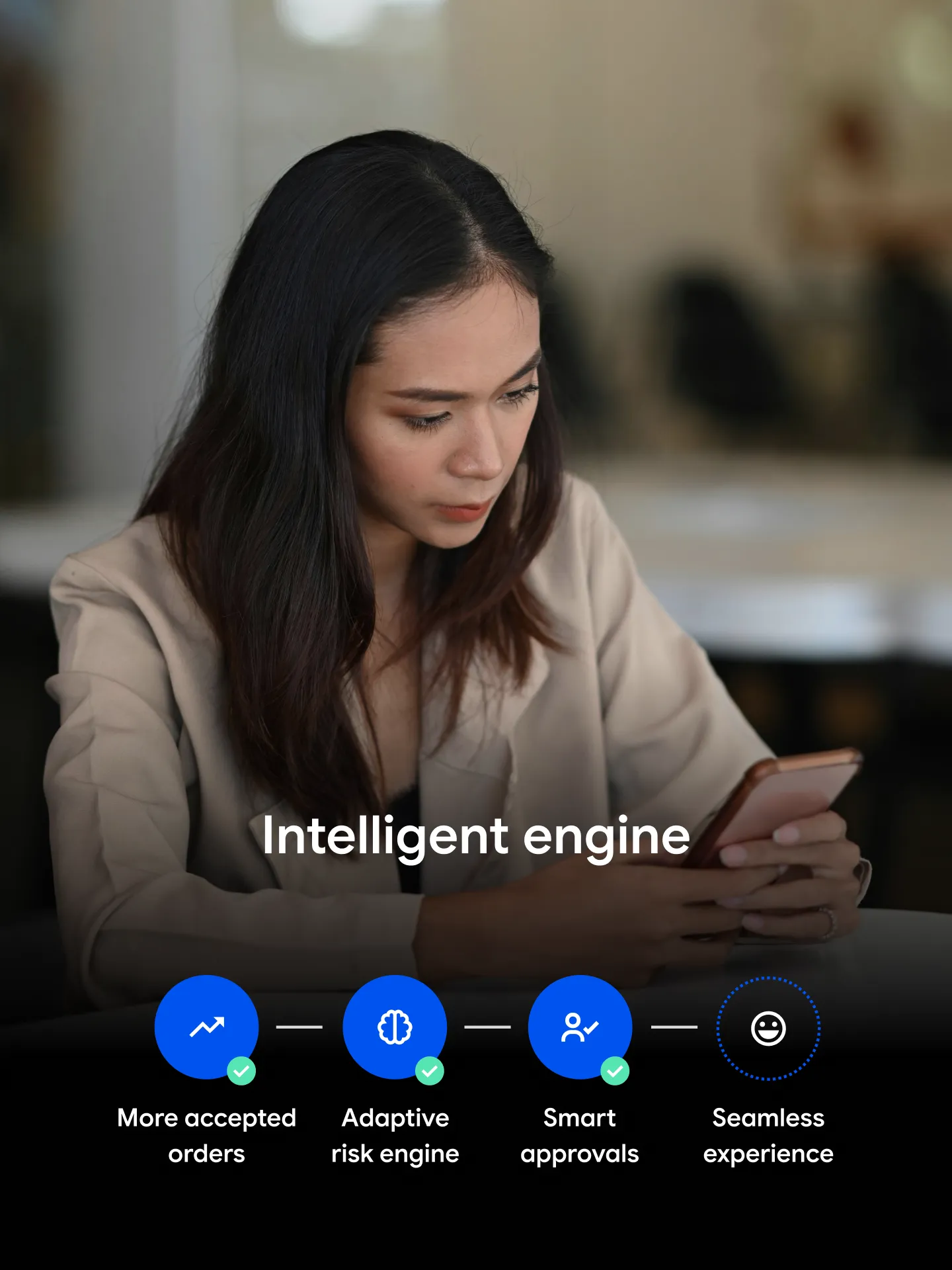 Woman holding phone with text about intelligent engine and benefits displayed below her.