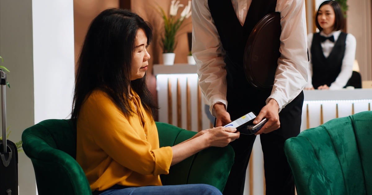 Source: https://www.freepik.com/free-photo/female-tourist-using-mobile-nfc-payment-pos-terminal_325962985.htm#fromView=search&page=1&position=4&uuid=2f0342c2-76db-4f8f-87ca-9e6aa61cf623&query=+asian+woman+pay+hotel