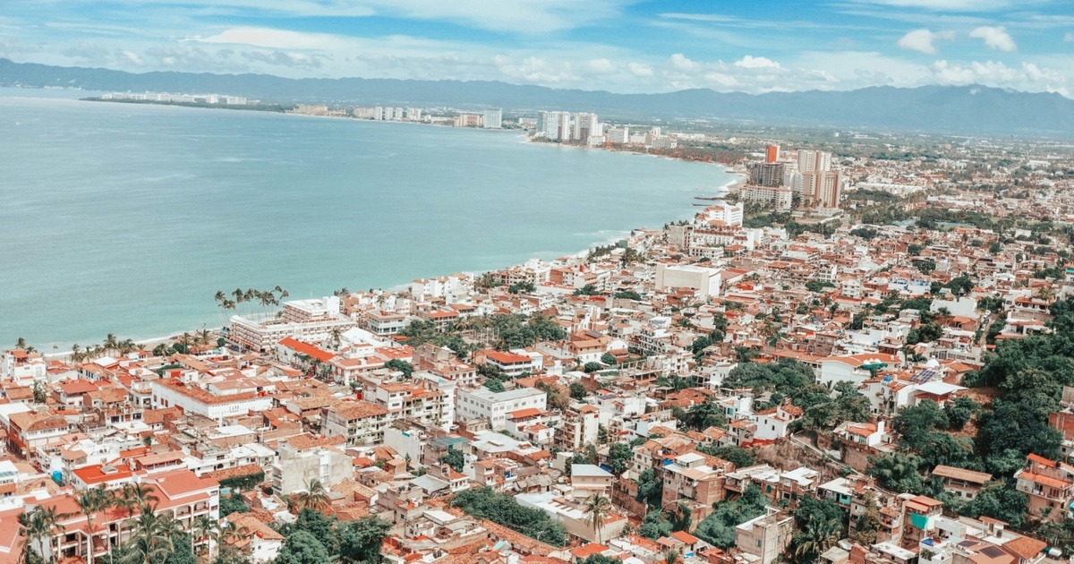 Source: https://unsplash.com/photos/aerial-view-of-city-near-body-of-water-during-daytime-S80jRUrTAqA