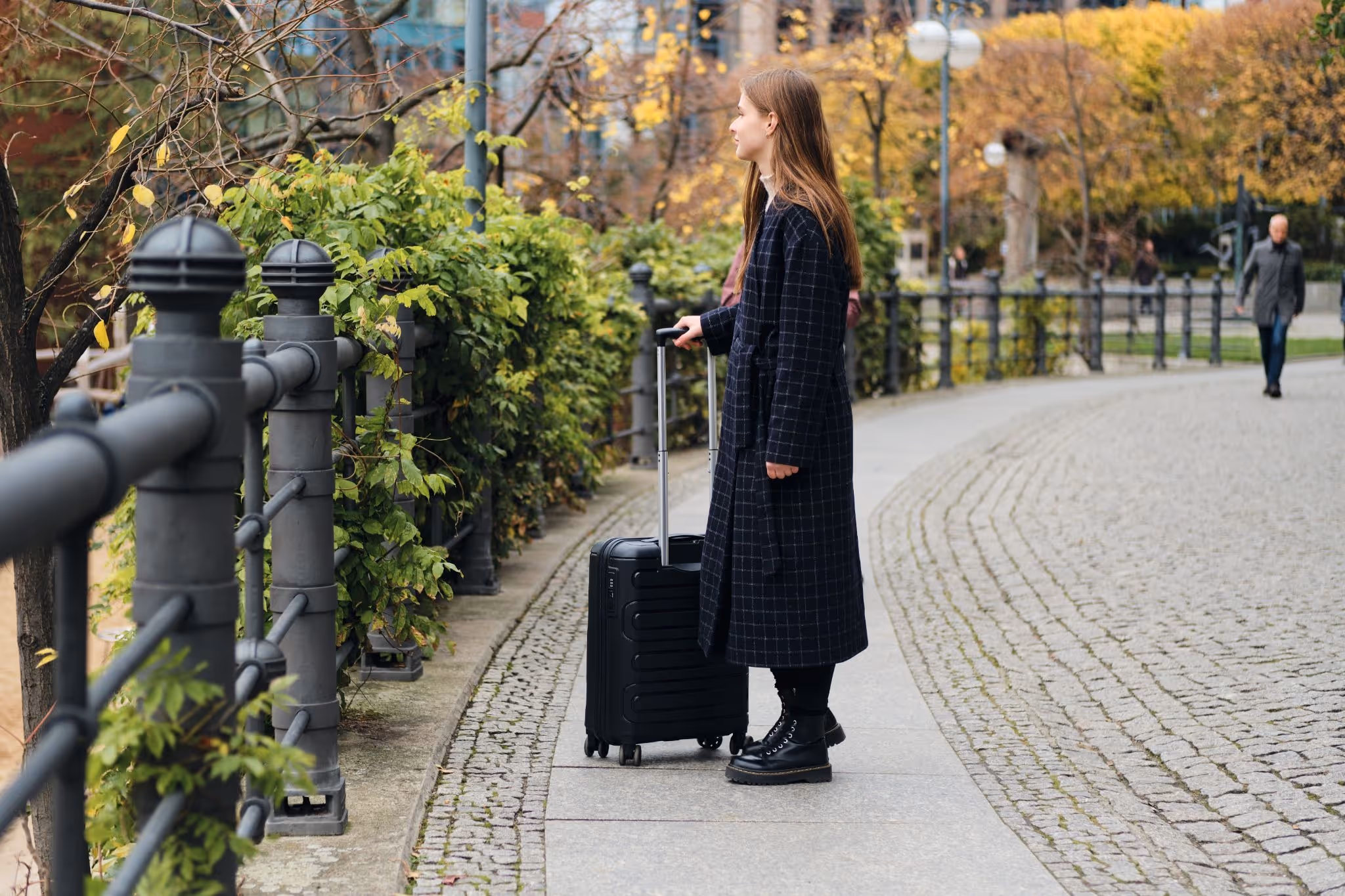 source: https://www.magnific.com/free-photo/side-view-attractive-casual-girl-coat-thoughtfully-walking-through-street-with-little-black-suitcase_23401136.htm#fromView=search&page=1&position=0&uuid=3e60586a-514f-4970-94d4-5dde57b7adc7&query=suitcase+in+denmark
