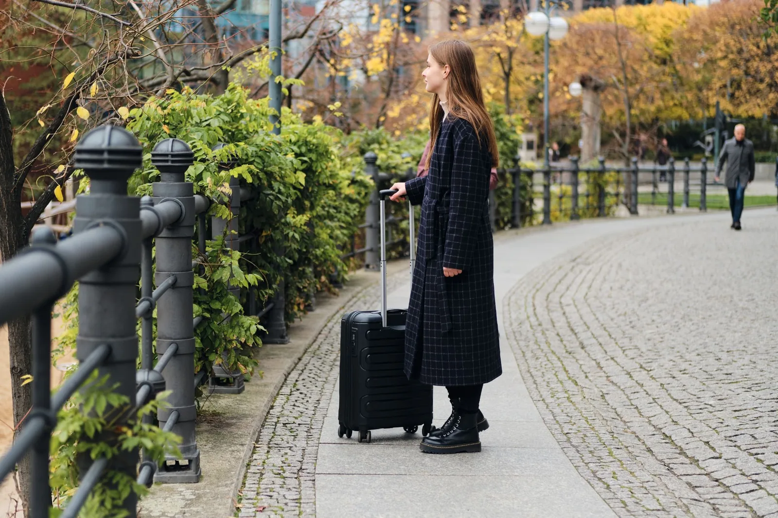 source: https://www.magnific.com/free-photo/side-view-attractive-casual-girl-coat-thoughtfully-walking-through-street-with-little-black-suitcase_23401136.htm#fromView=search&page=1&position=0&uuid=3e60586a-514f-4970-94d4-5dde57b7adc7&query=suitcase+in+denmark