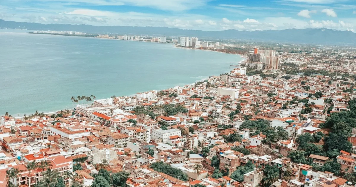 Source: https://unsplash.com/photos/aerial-view-of-city-near-body-of-water-during-daytime-S80jRUrTAqA
