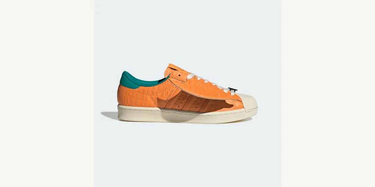 Official orange adidas Charizard Superstar Vintage shoe KI2861 with a wing detail