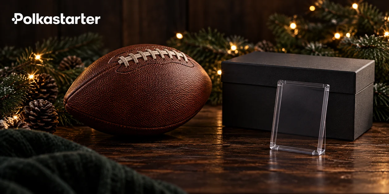 Editorial still life of an American football, pine branches and an empty card holder