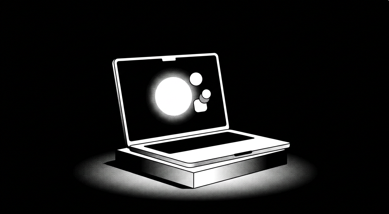 Black and white illustration of a laptop in a spotlight, its screen displaying a glowing circle with two smaller circles beside it resembling a chat or user interface icon, against a black background