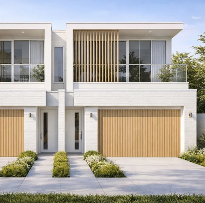 Modern two-story duplex with white brick exterior, wooden garage doors, glass balcony, and landscaped front yard.