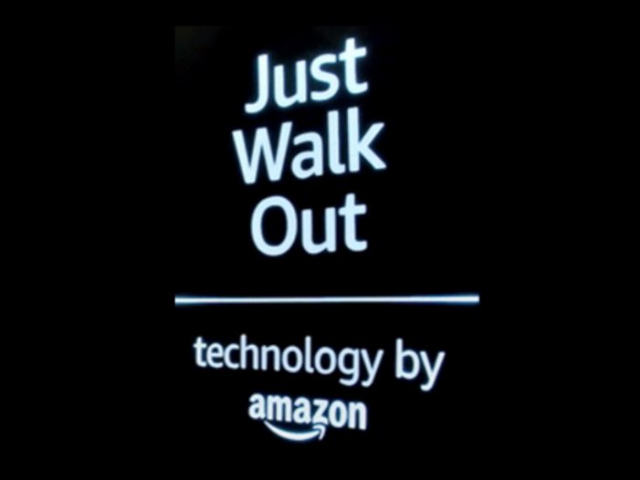 Illuminated sign reading Just Walk Out technology by Amazon
