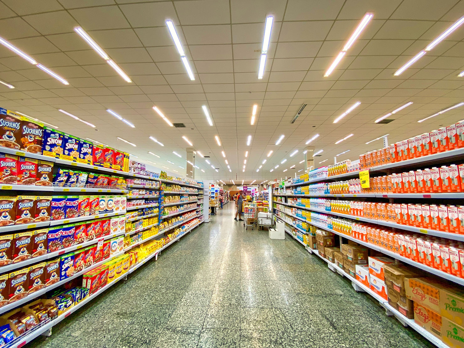 A photo of a cereal isle in a supermarket.