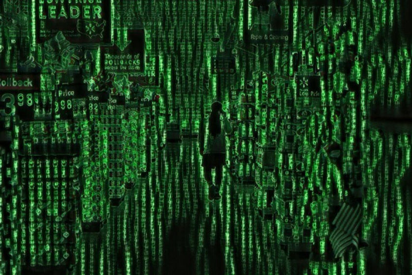 An image of a supermarket aisle that has that a filter reminiscent of the matrix on it. Alphabetic characters make up the structure of the image.