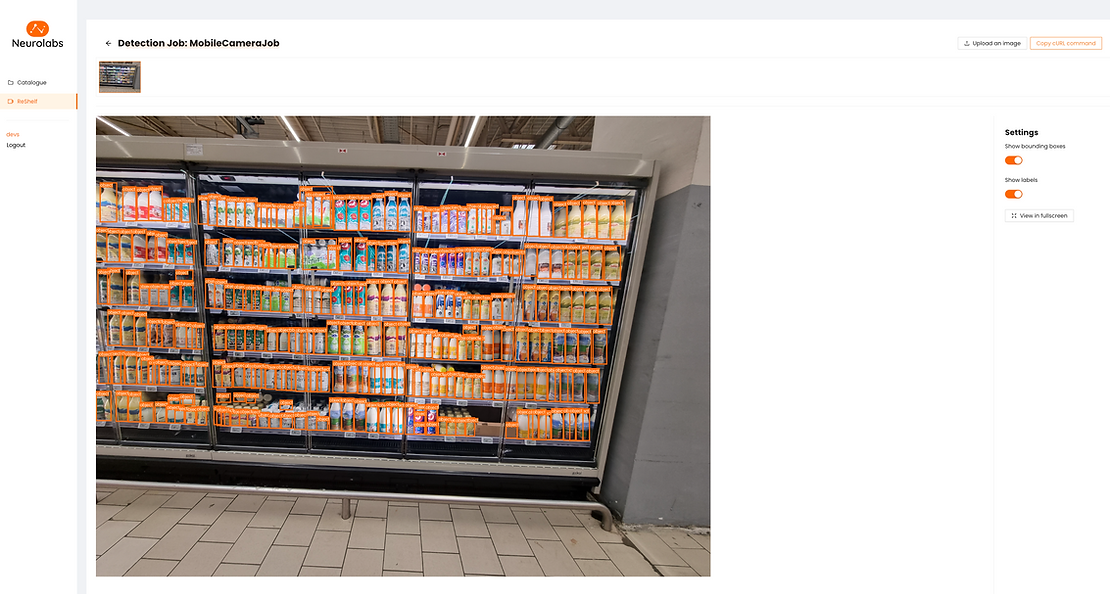 An image of the Neurolabs platform with product detections being carried out. There is an image on the platform of a supermarket fridge and the products have bounding boxes around them.