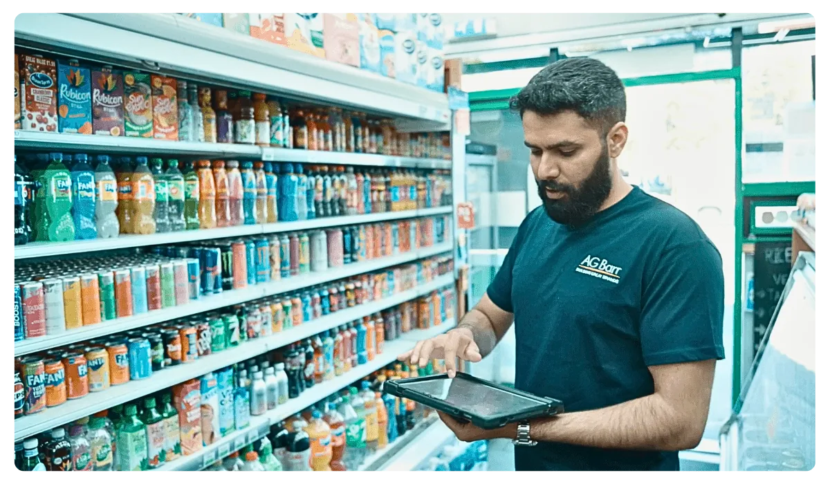 AG Barr field representative using a tablet to capture retail execution data in store.