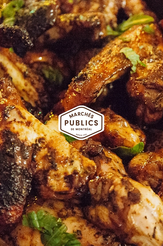 Close-up shot of marinated chicken with teh Marchés Publics de Montréal's logo in the middle.