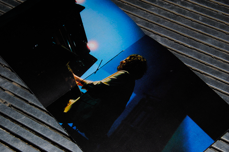 Close-up shot of the vinyl's booklet showcasing a shot of Alexandra Stréliski during one of her concerts.
