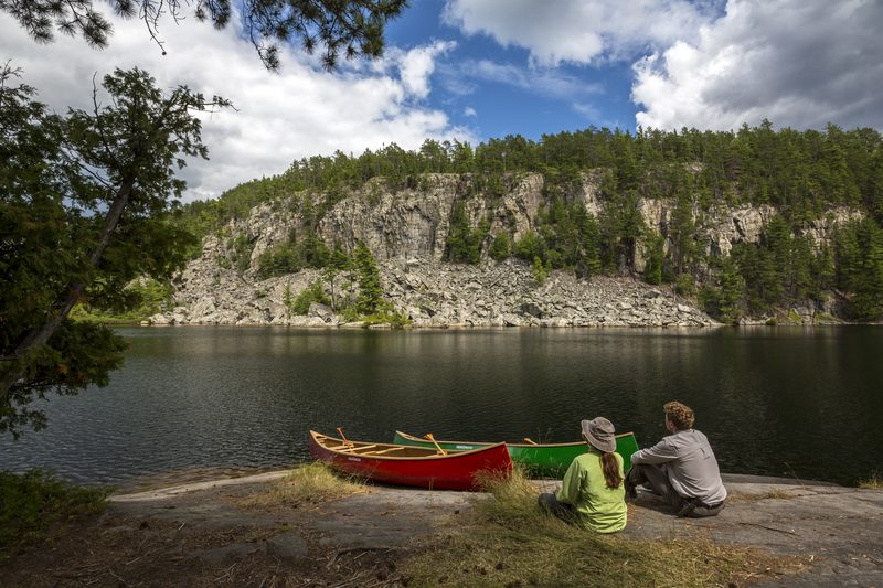 Canoes at the base of Temagami cliffs