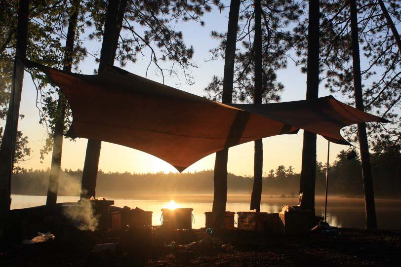 Campfire on a Temagami shoreline at dusk