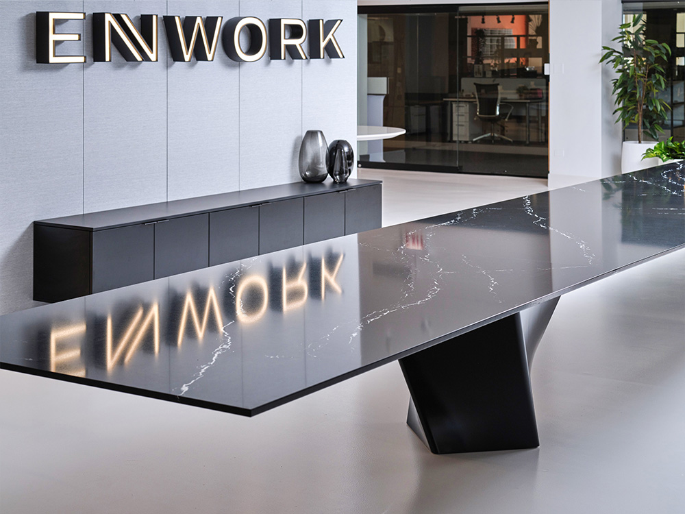 Conference table with storage against wall