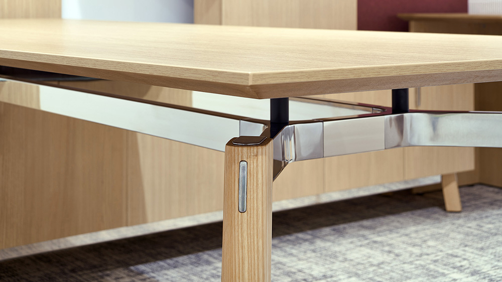 Wood pieces and polished aluminum trim piece close up