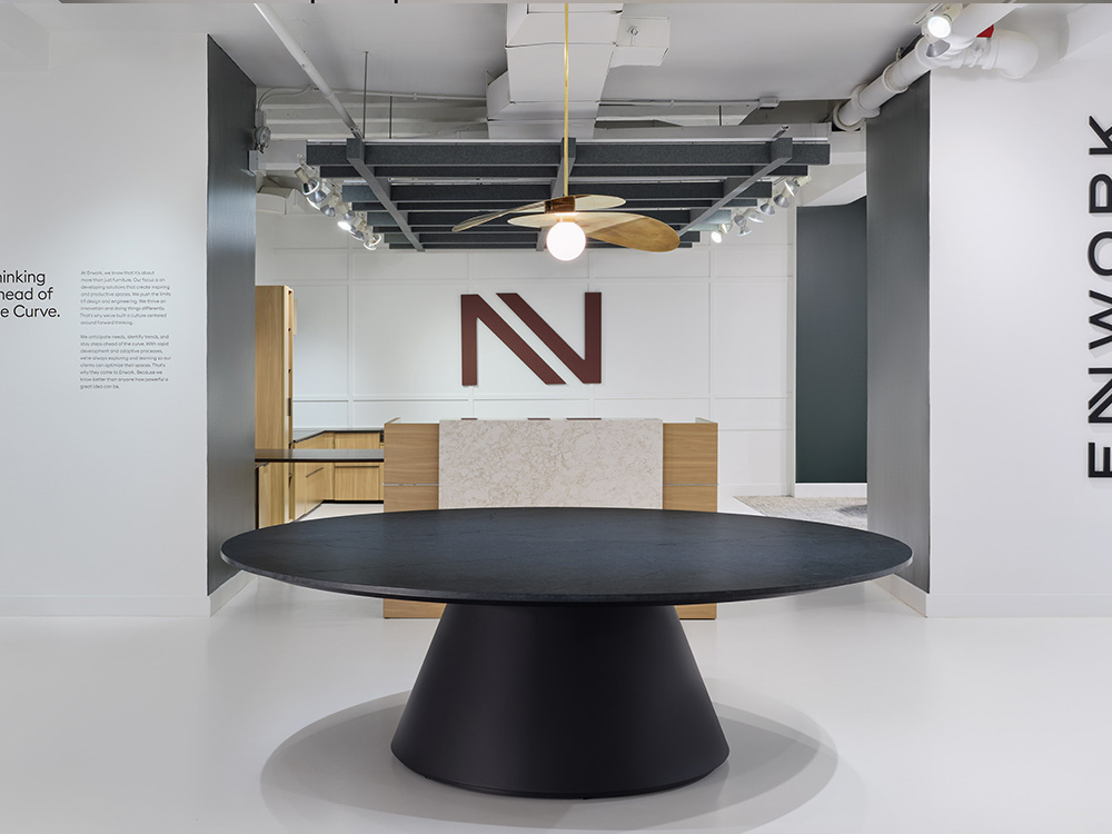 Round table with N on wall