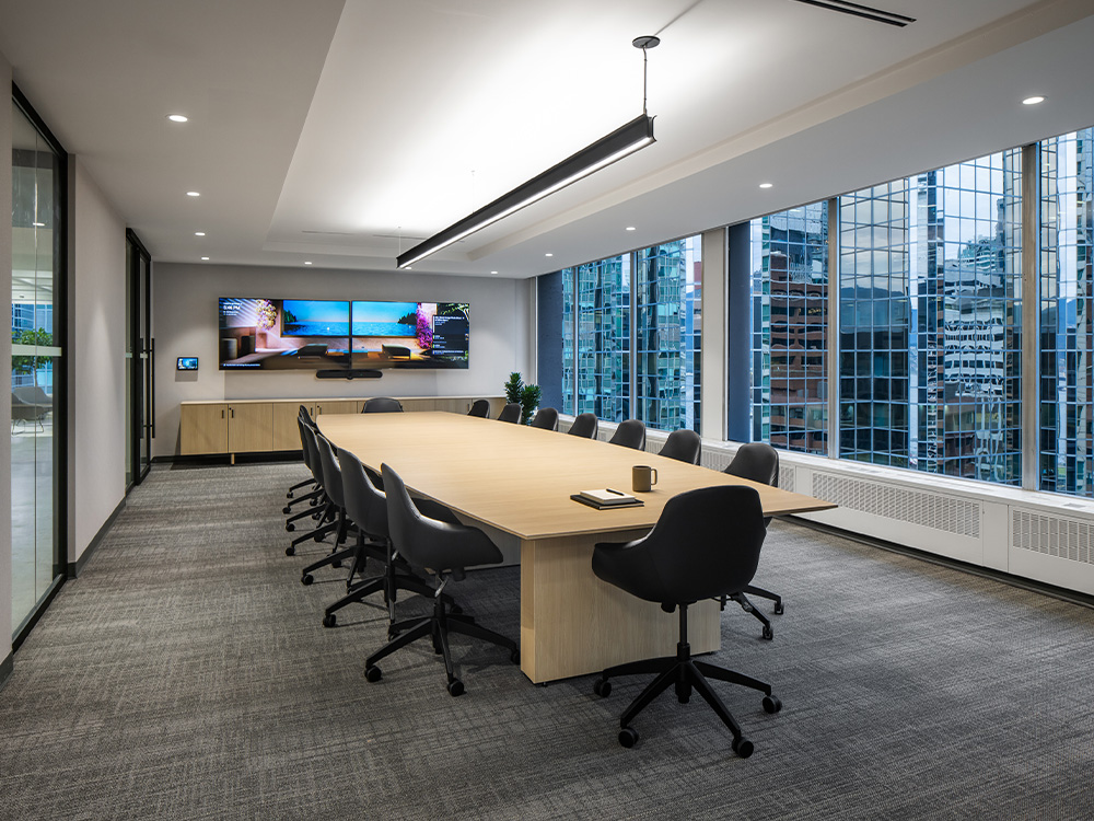 Large table with chairs and TV