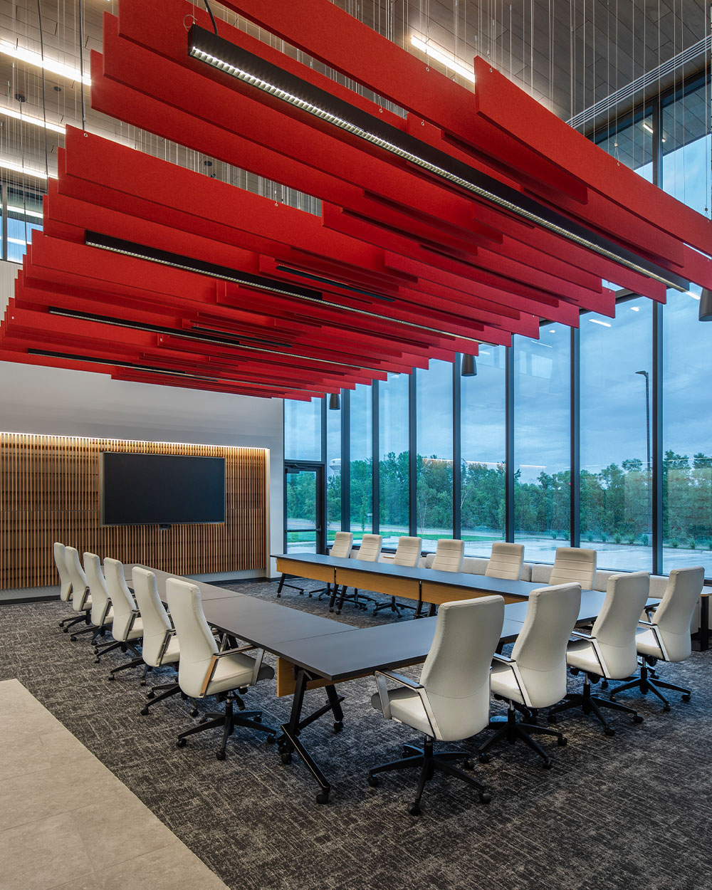 Large room with multiple tables and red ceiling