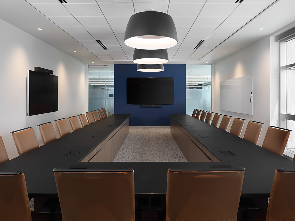 Large table with chairs and TV