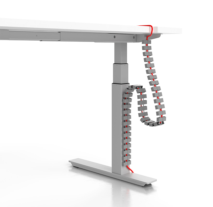 Cable manager going down a desk base. 