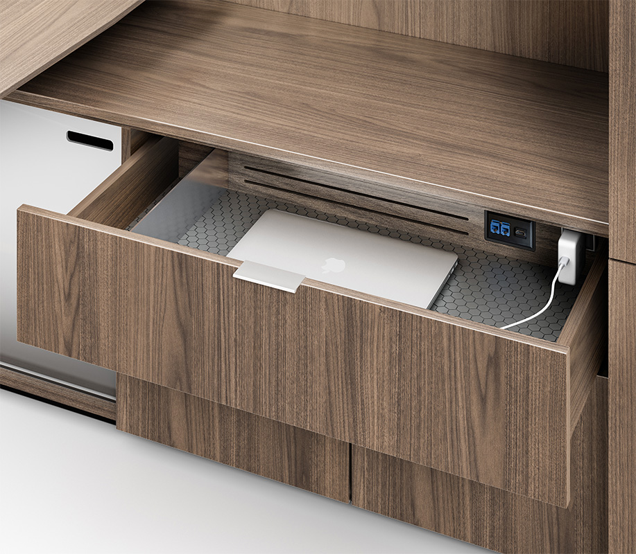 Cayman tech drawer with laptop plugged into outlet. 