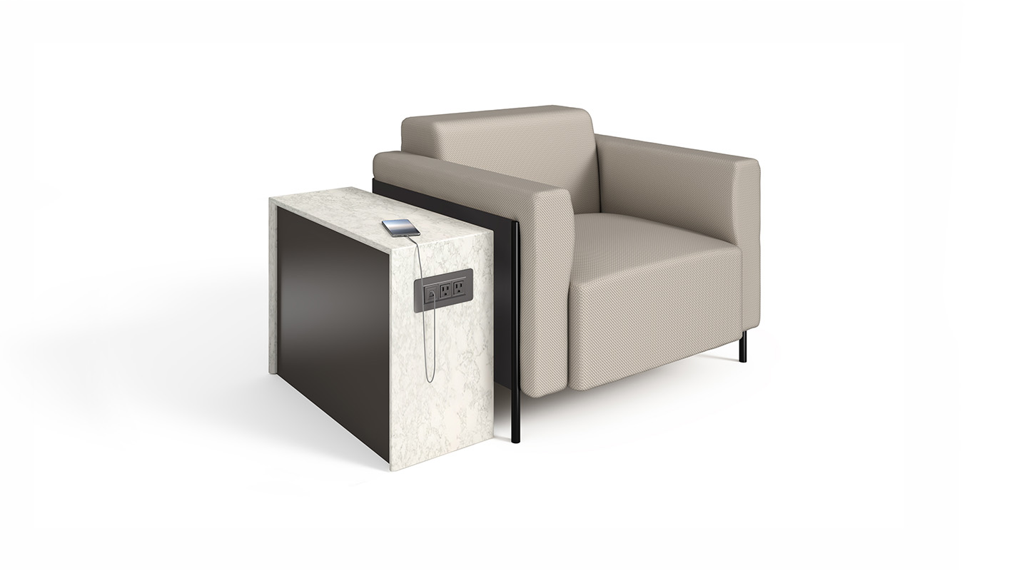 Cortina next to a chair with a phone plugged in. 