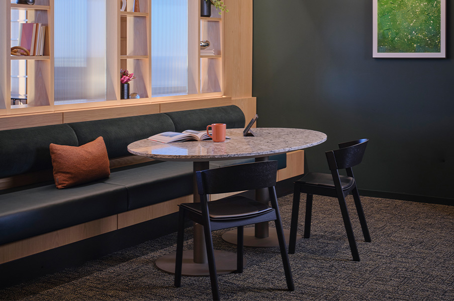 Disc base table with chairs and booth. 