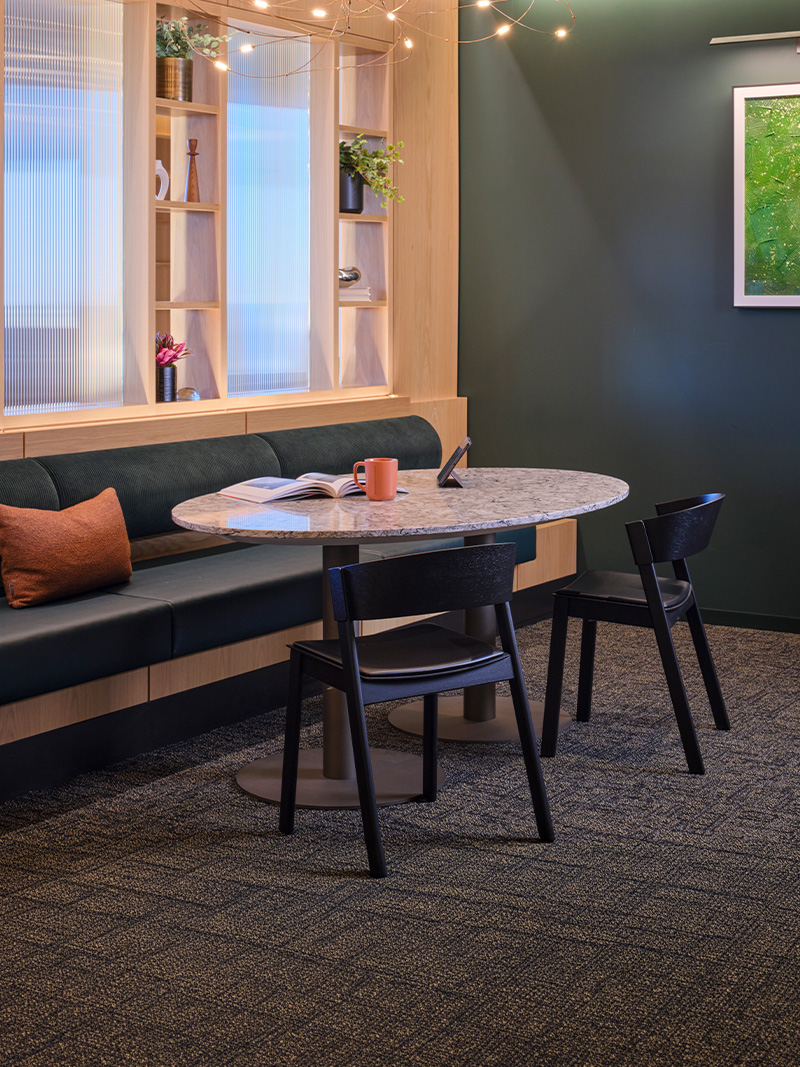 Disc base table with chairs and booth. 