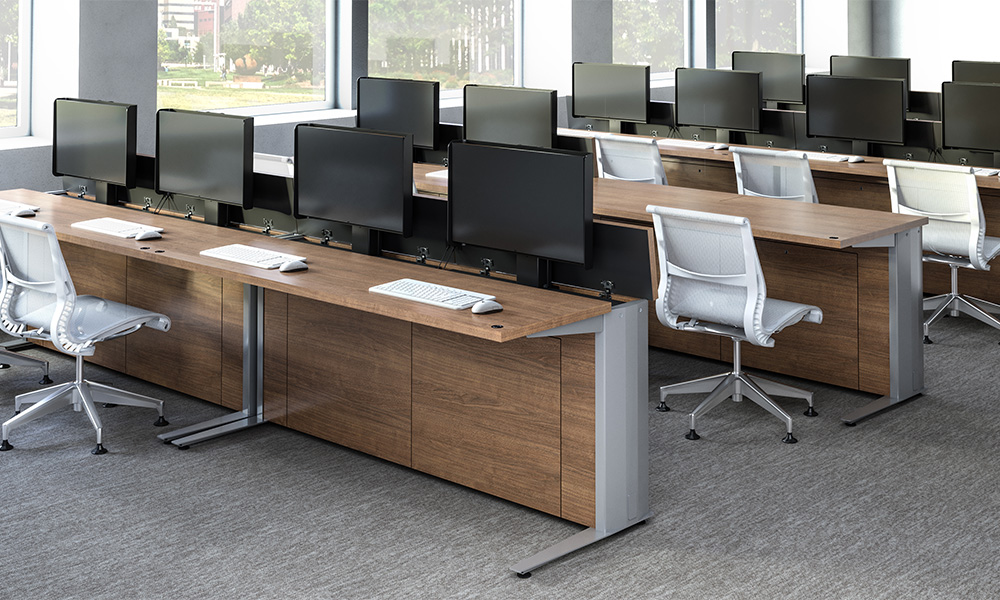 Rows of Zori Monitor Lift tables for computer lab application