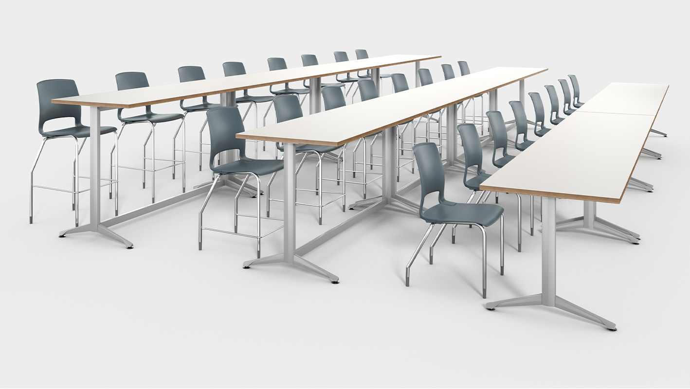 Zori T-Leg Training tables in tiered classroom configuration against white background