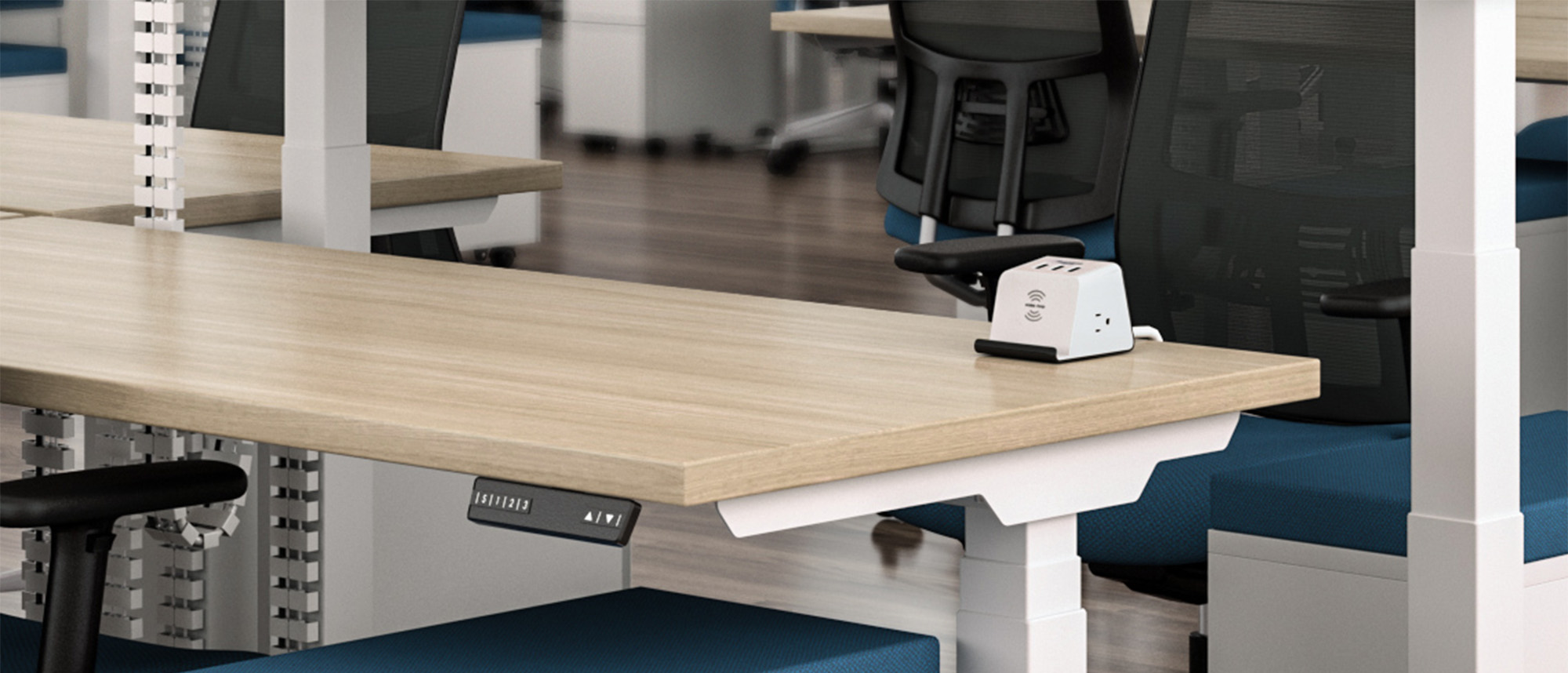 Supreme Power Unit on desk in open-plan office