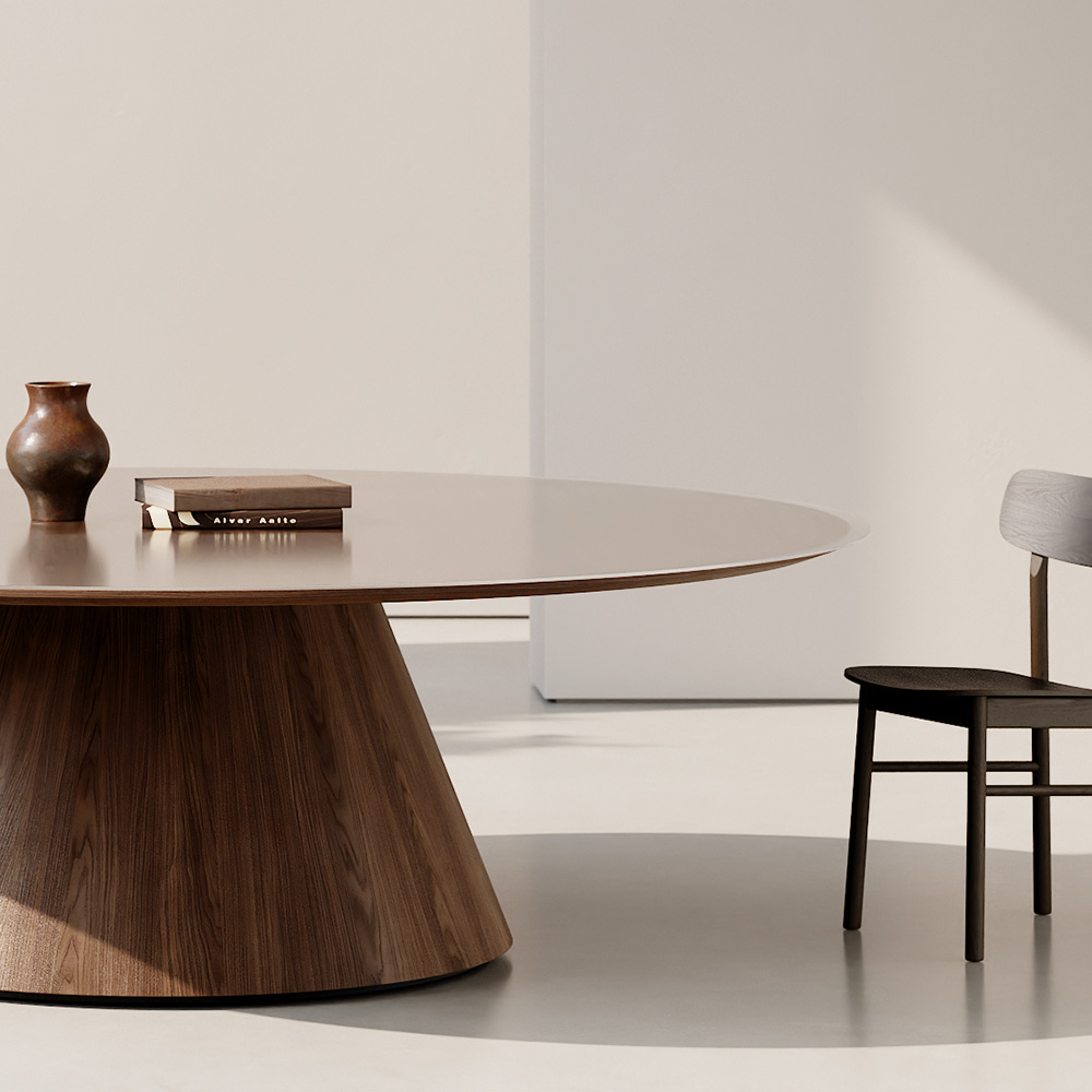 Foundation Tapered drum conference table in a white room. 