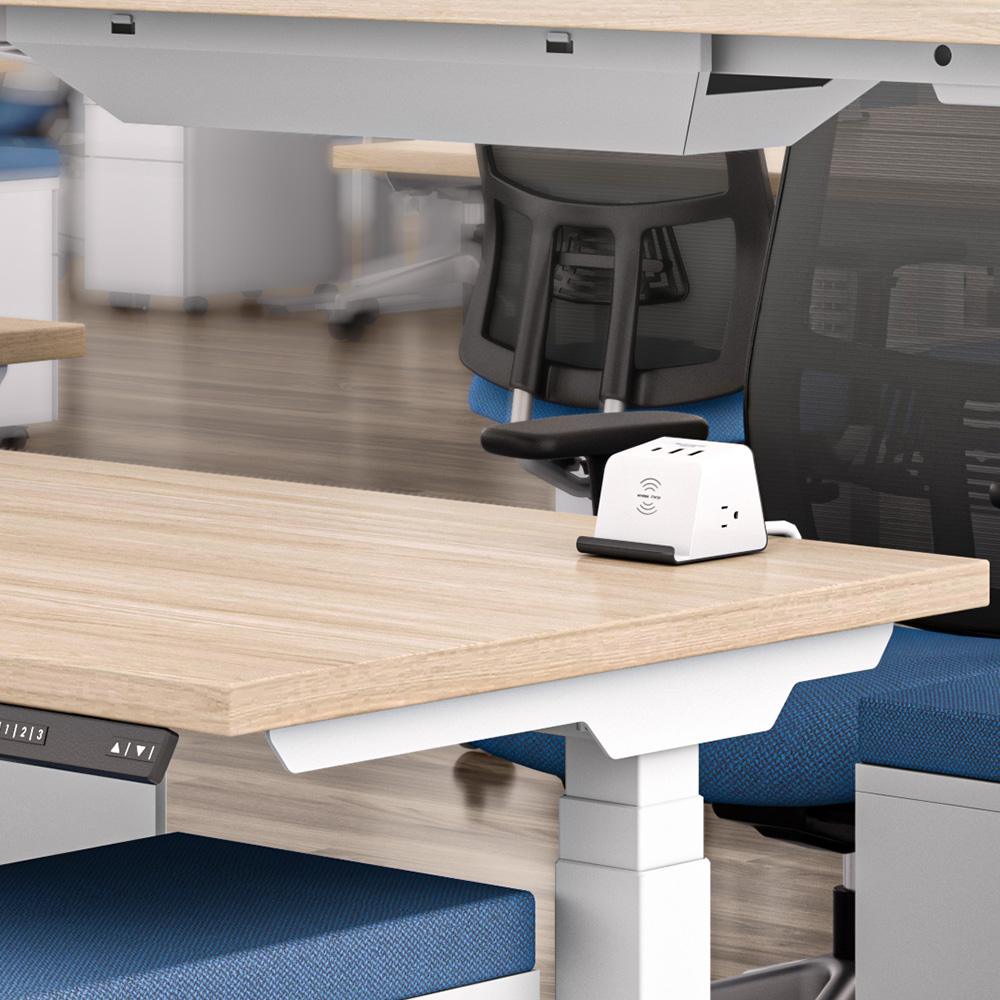 Supreme Power Unit on desk in open-plan office