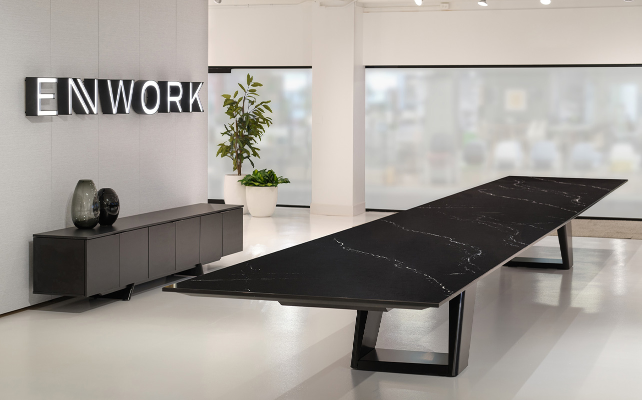 Expanse table in a conference room with a credenza. 