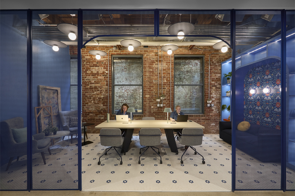 Expanse conference table in small meeting space.