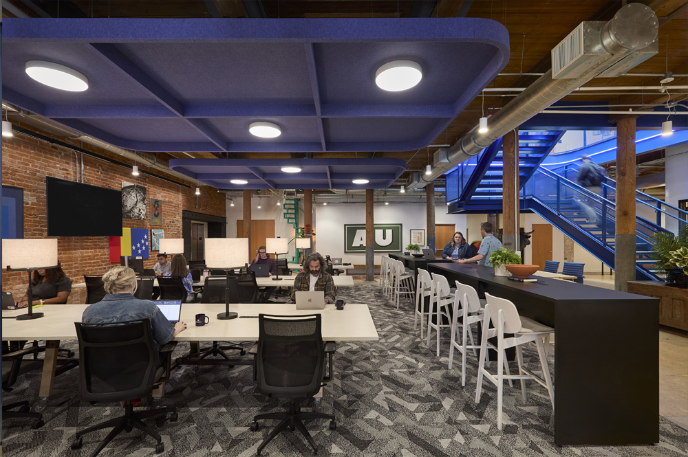 Landing and Adventure tables in communal working space.