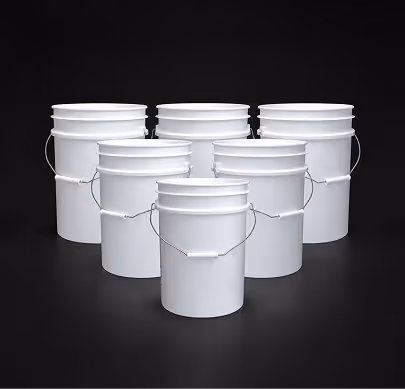 Six white plastic buckets with handles, arranged in two rows on black background.