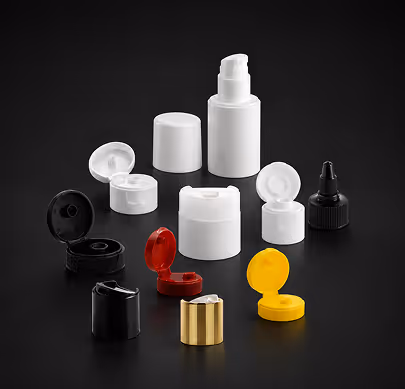 Various closed and open plastic and metal lotion and cream bottle caps in black, white, red, yellow, and gold.