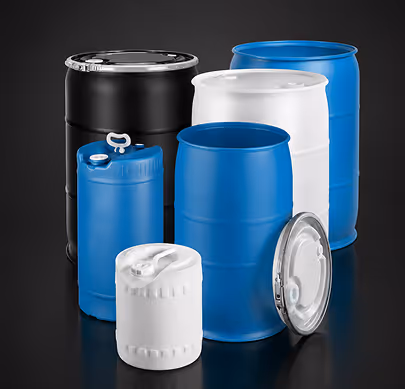 Group of black, white, and blue plastic and metal industrial drums and barrels on a dark background.