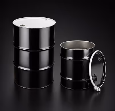 Two black metal barrels on black surface, one closed and one open with a detached lid.